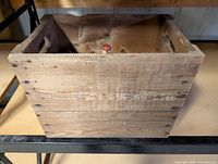 Top view of wood crate showing interior and spritzer bottle