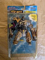 Front of sealed Cy-Gor action figure in blister package
