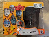 Front of collectors box with character masks, DC and Culturefly branding