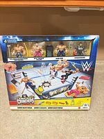 Rear of sealed WWE Knuckle Crunchers box showing four figures in blister and accessory illustrations