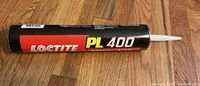 Full view of sealed Loctite PL 400 adhesive tube