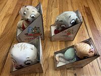 Four Caring Cats plush toys in packaging
