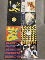 All eight records laid out showing front sleeves