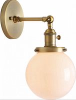 Stock image showing assembled brass wall sconce with glass globe lit