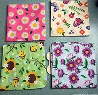 Four folded bandanas showing distinct patterns