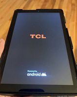 Tablet powered on displaying TCL boot screen