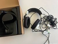 Headset, cables, and open original box with plastic tray
