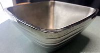 Square stainless bowl angled view showing shape and finish
