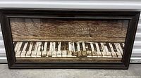 Front view of framed piano print