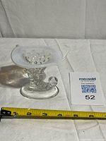 Front view showing full vase and tape for scale