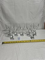 Full set of seven Holmegaard wine glasses with tape measure for scale