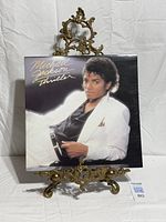 Front of Thriller album jacket on stand