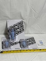 All three sealed figures with tape measure for scale