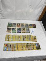 Overview of two spread rows and large stack of Pokémon cards