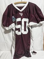 Full view of maroon and white number 50 jersey
