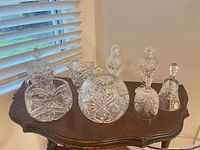 All seven crystal pieces on small table