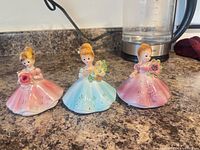 Front view of all three Josef Originals figurines on countertop