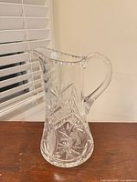 Full view of clear lead crystal pitcher on table
