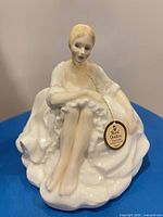 Front view of Royal Doulton Joanne figurine with hang tag visible