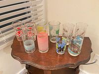 Front view of all 10 assorted tall tumblers on table