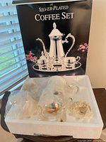Retail box showing full silver-plated coffee set