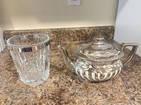 Teapot and ice bucket side by side on countertop