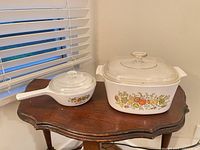 Overall view of saucepan and casserole with lids