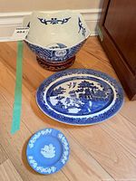 Overall view of all items: porcelain bowl on stand, transferware platter, jasperware dish