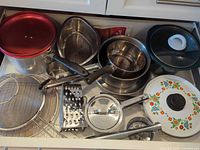 Drawer view showing all cookware pieces together