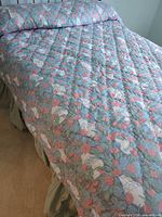 floral comforter and matching pillow sham on bed