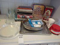 Group shot of all kitchenware, bakeware, cookbooks on counter
