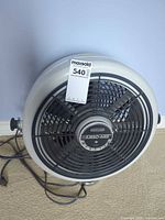 Front view of Seabreeze Turbo-Aire floor fan showing grille, branding and power cord