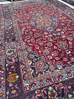 Closer angle of carpet corner and border detailing