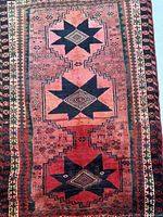 Full view of rug showing complete field and borders