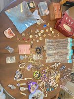 Full view of assorted jewelry spread out showing quantity and variety