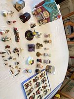 Group shot showing cookie jar, mug and array of small figurines
