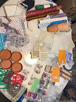 overview of stencils, paints, terracotta saucers, glitter, wrap rolls
