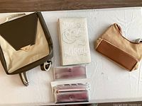 Overall lot with backpack, plaque, wallet, pouch