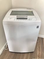 Front view of LG white top-load washing machine