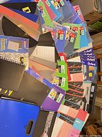 Overall view of folders, notebooks, dividers and stapler spread on table