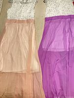 Both dresses side by side showing colour difference and design