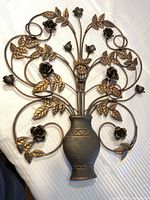 Full view of metal floral wall decor showing vase, stems, roses and leaves