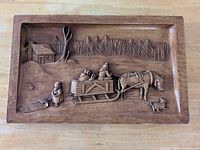 front view showing full carved scene and dimensions context