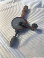 Full view of hand drill showing chuck, gear and handle