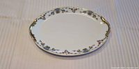 Top view showing full Limoges oval platter, floral pattern, gold rim and handles