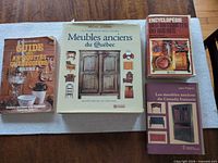 Front covers of the four French antique reference books