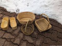 All five baskets on ground showing shapes and sizes