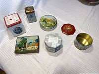 All seven tins arranged for overview