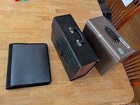 All three storage items side by side on table