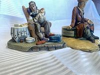 Both figurines side by side showing overall form and paint